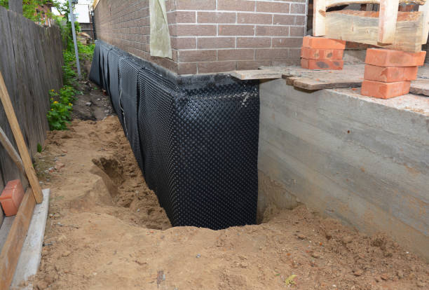 Happy homeowners after waterproofing job in Van Buren